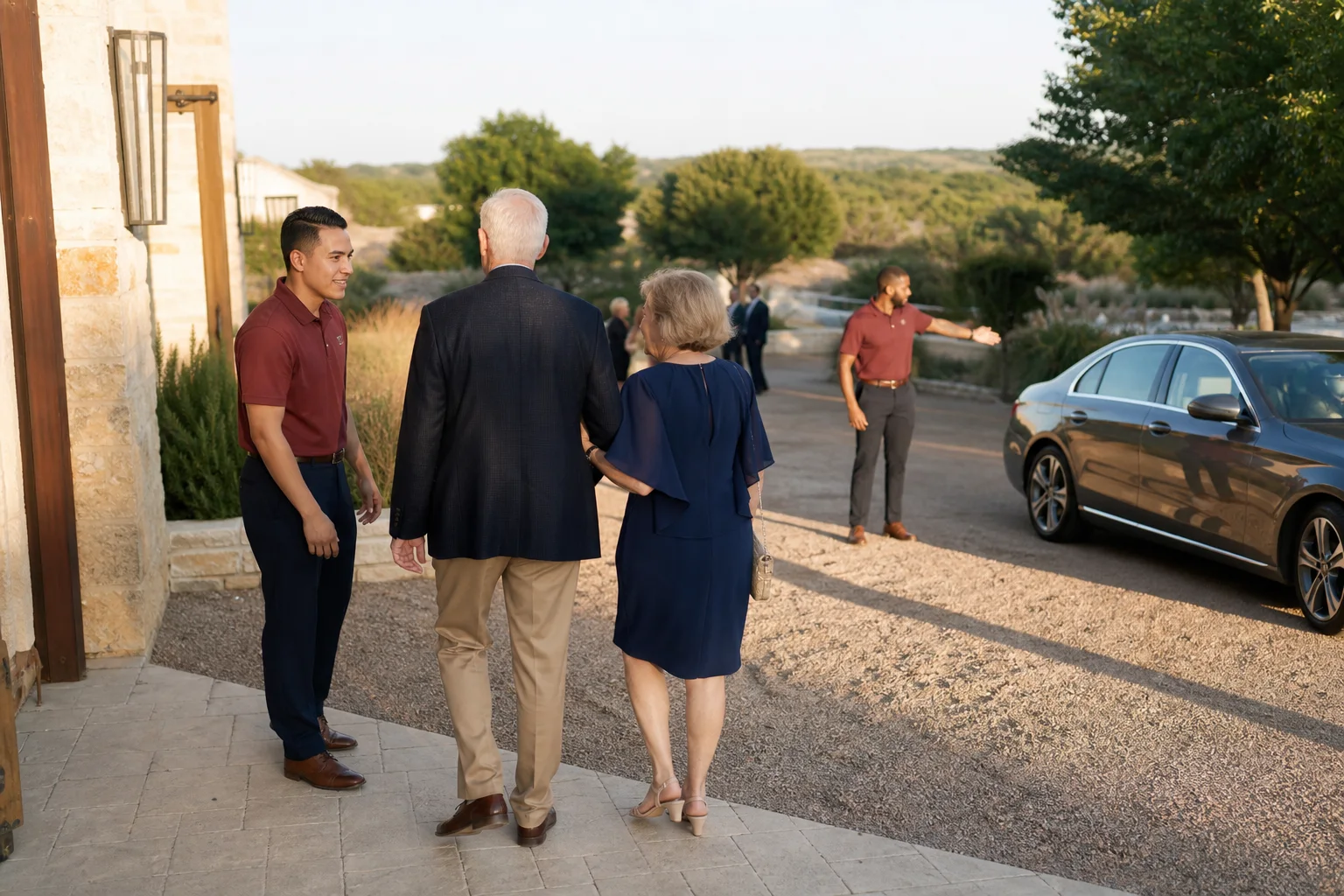 Valet attendants greeting wedding guests at a Hill Country venue near Austin